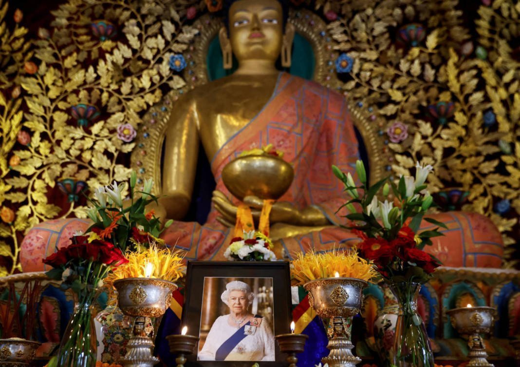 A Portrait Of Britain's Queen Elizabeth Is Placed In Front Of An Idol Of Buddha During A Prayer Session To Mark Her State Funeral And Burial, At Ka Nying Shedrub Ling Monastery