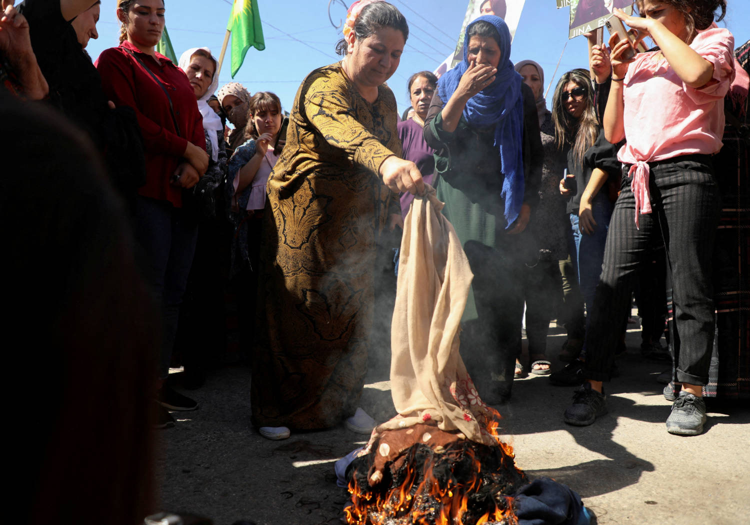 Women Burn Headscarves During A Protest Over The Death Of Mahsa Amini In Iran, In The Kurdish Controlled City Of Qamishli