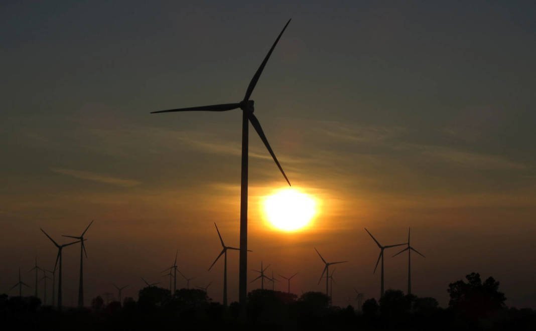 File Photo: The Sun Sets Behind Power Generating Wind Turbines From A Wind Farm Near The Village Of Ludwigsburg