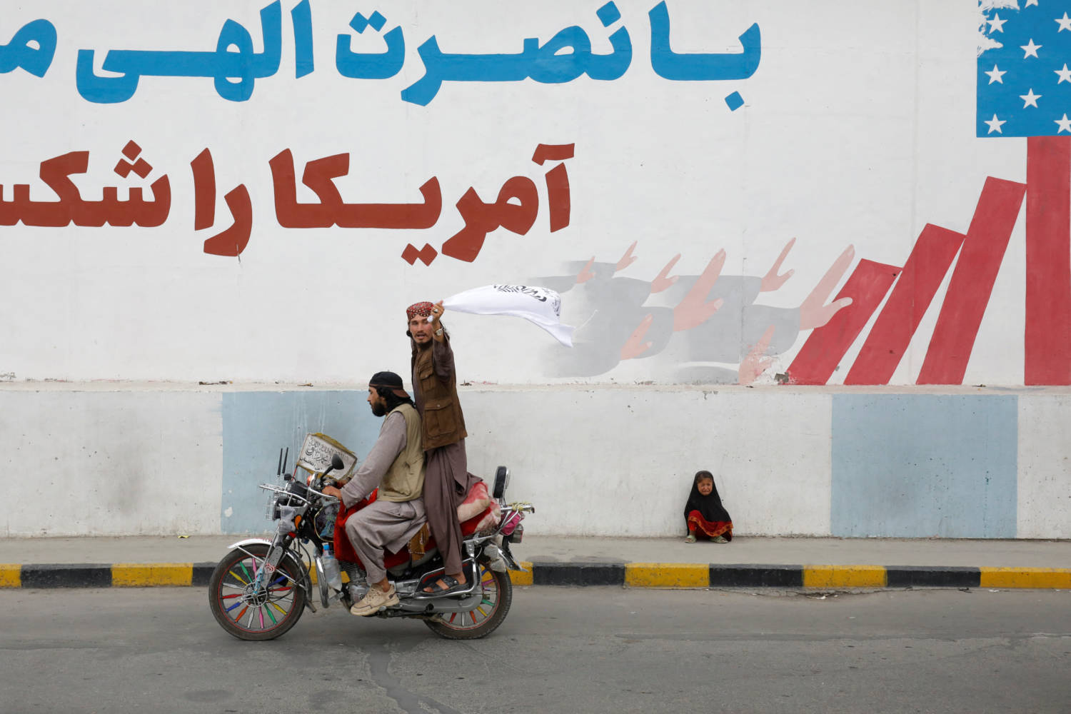 Taliban Supporters Hold An Islamic Emirate Of Afghanistan Flag On The First Anniversary Of The Fall Of Kabul