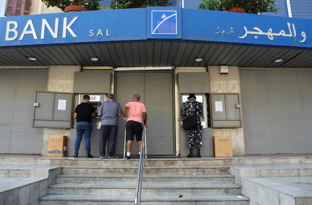 People Use Atm Machines At A Closed Blom Bank Branch In Beirut