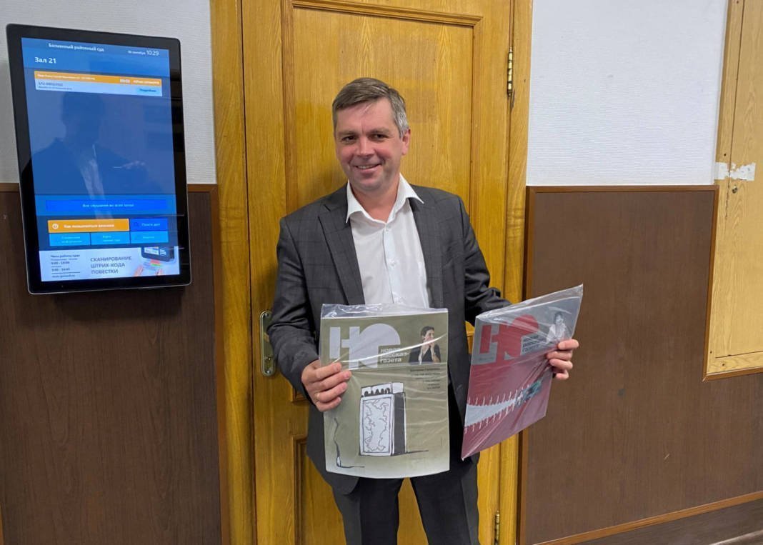 Novaya Gazeta Lawyer Yaroslav Kozheurov Holds Copies Of Novaya Gazeta's Magazine 