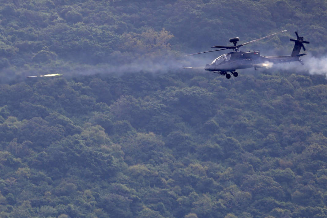 An Ah 64 Apache Fire A Rocket During A Live Fire Military Exercise In Pingtung