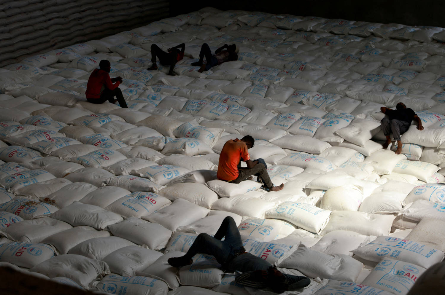 Labourers Rest As They Offload Bags Of Grains As Part Of Relief Food That Was Sent From Ukraine At The Wfp Warehouse In Adama Town.
