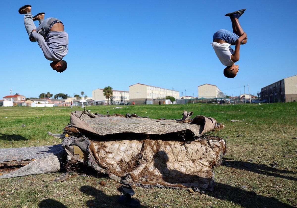 Boys Playing On Old Mattresses In Cape Town