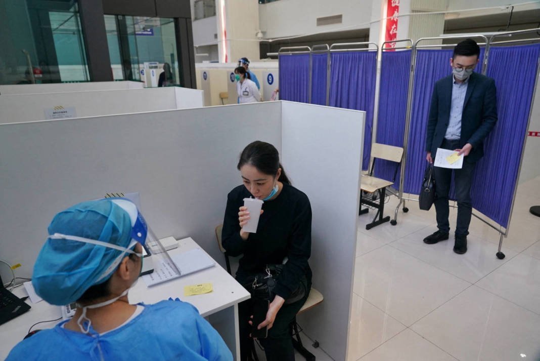 Resident Takes An Inhaled Covid 19 Vaccine As A Booster Dose At A Hospital In Shanghai