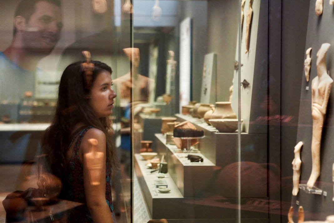 File Photo: A Visitor Looks At Grave Offerings Of The Early Cycladic Ii Period, Dated Around 2800 To 2300 B.c, In The National Archaeological Museum In Athens