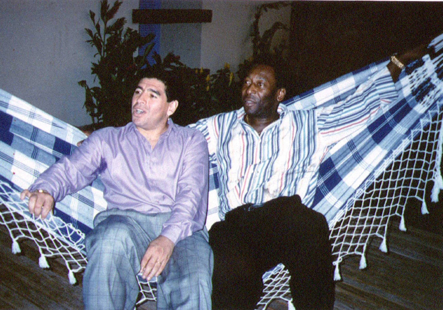 File Photo: Soccer Legends Diego Maradona And Pele Rest On A Hammock During A Reception In Rio De Janeiro