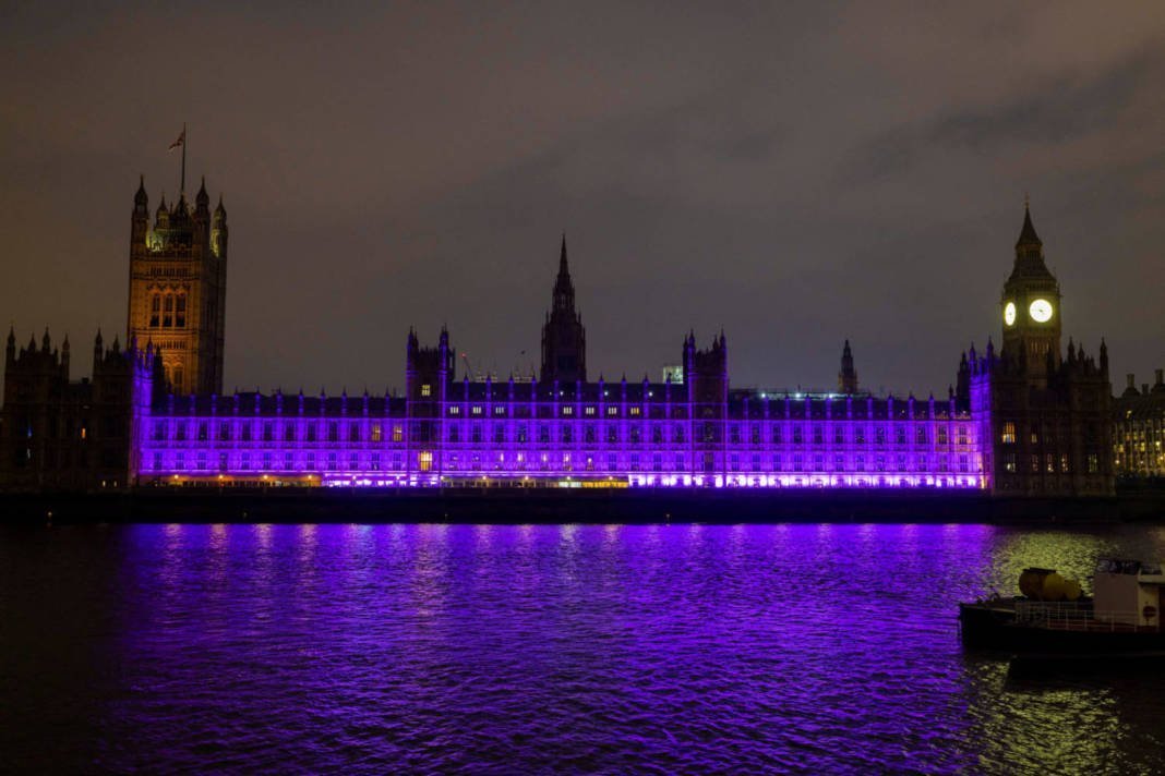 The Palace Of Westminster Lights Up Purple For International Day Of Persons With Disabilities In London
