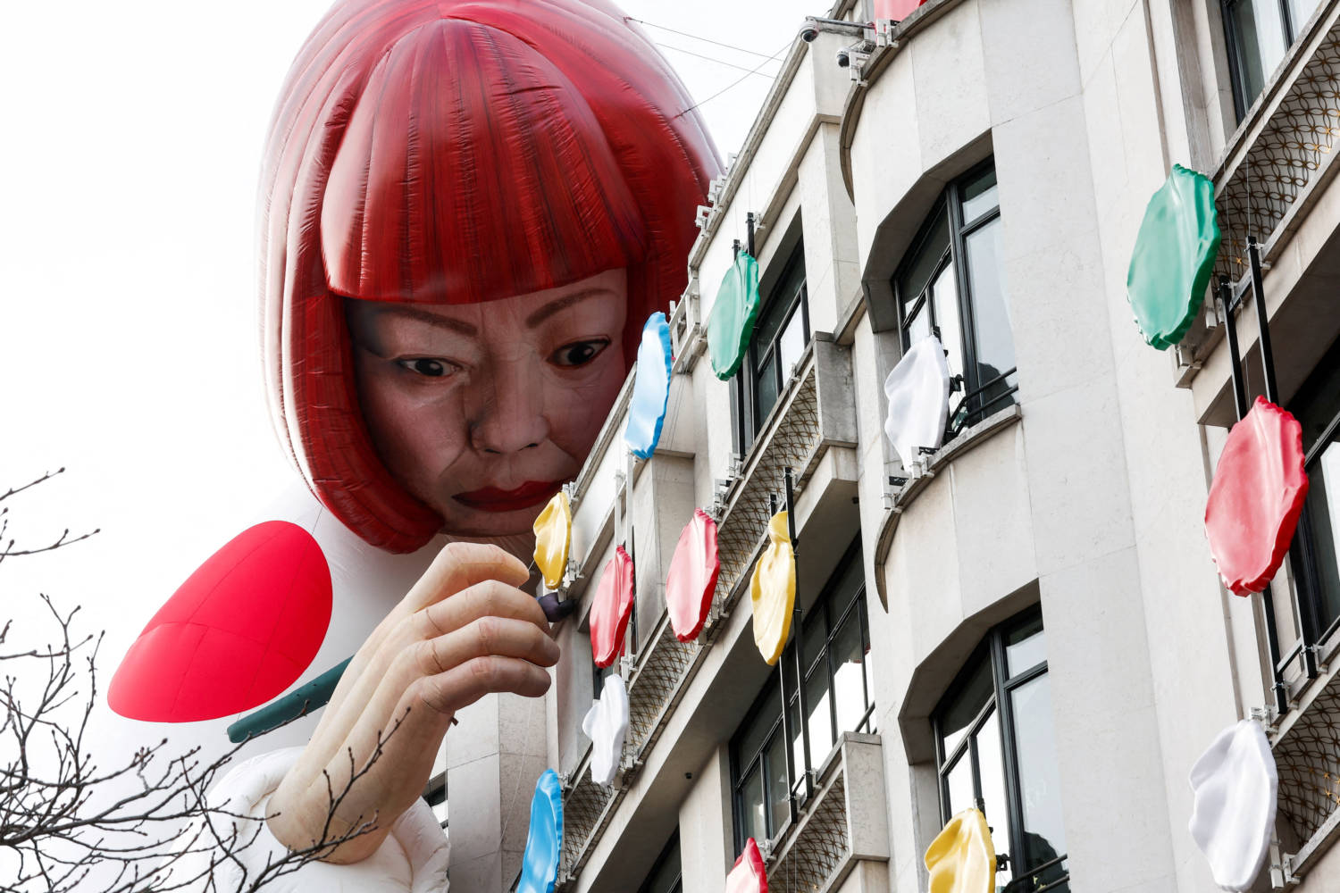 Installation Of Yayoi Kusama's Mannequin Covers The Exterior Of The Louis Vuitton's Flagship Store In Paris
