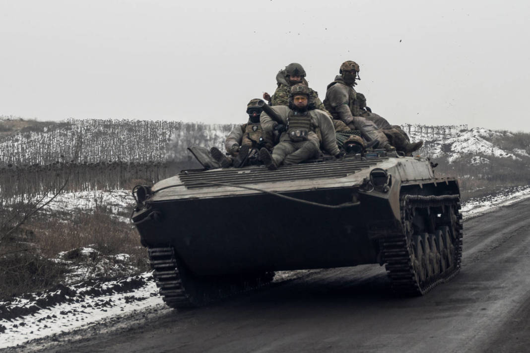 Ukrainian Servicemen Ride Atop An Infantry Fighting Vehicle Along A Road Near A Frontline In Donetsk Region