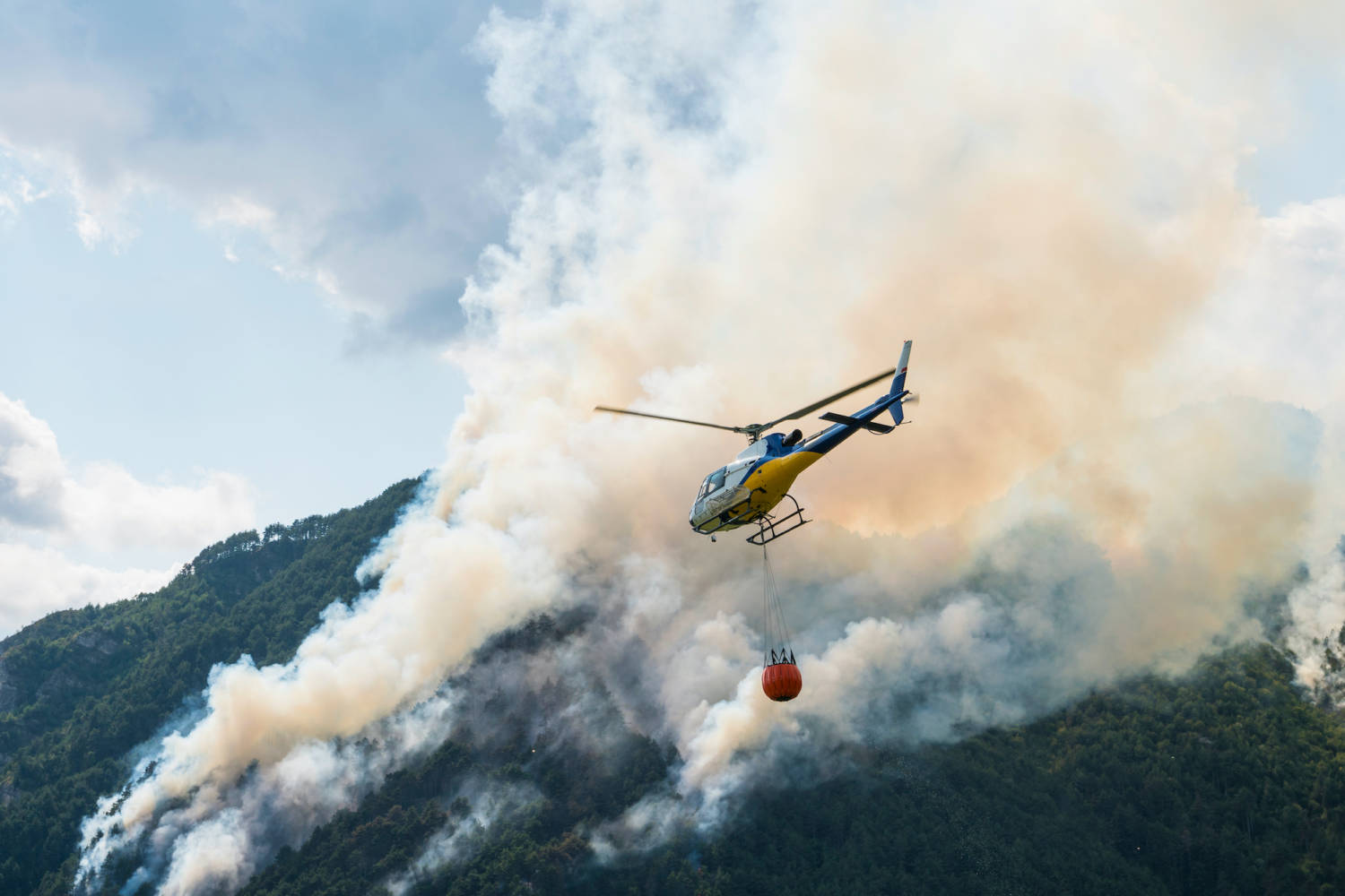 Aerial,firefighting,with,helicopter,on,a,big,wildfire,in,a