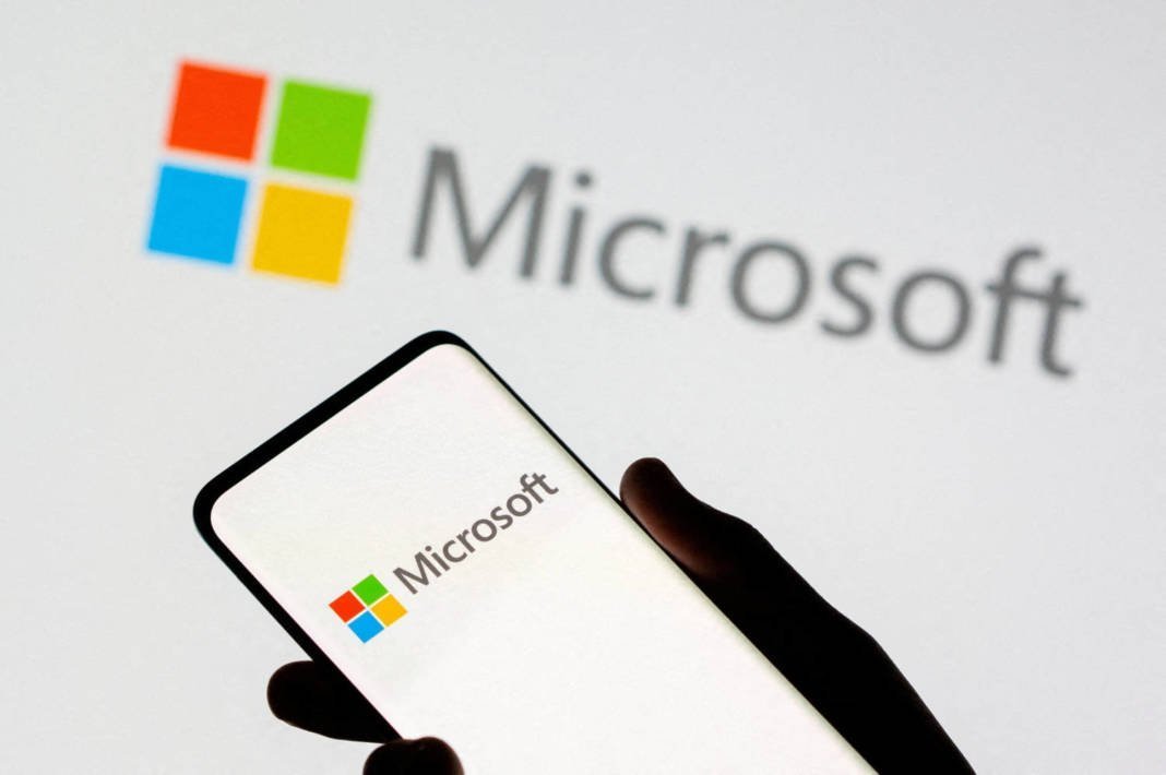 File Photo: Smartphone Is Seen In Front Of Microsoft Logo Displayed In This Illustration Taken