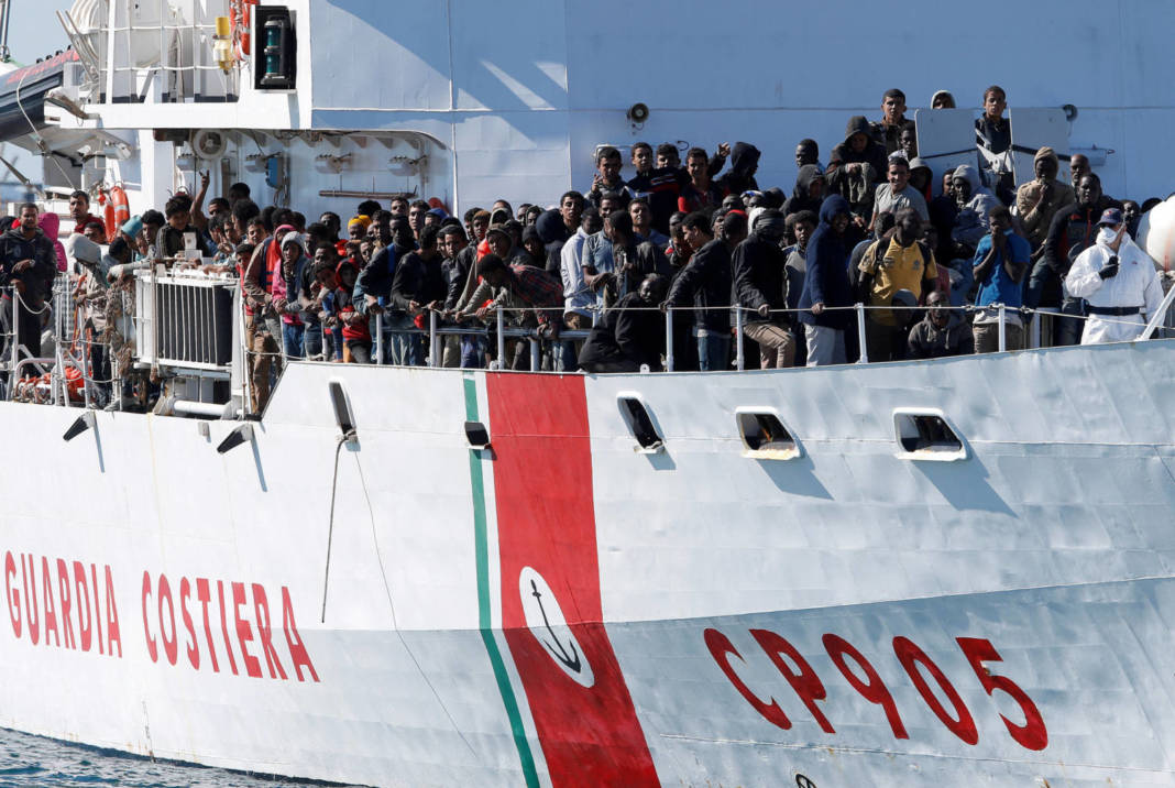 File Photo: Migrants Arrive By The Italian Coastguard Vessel Peluso In The Sicilian Harbour Of Augusta