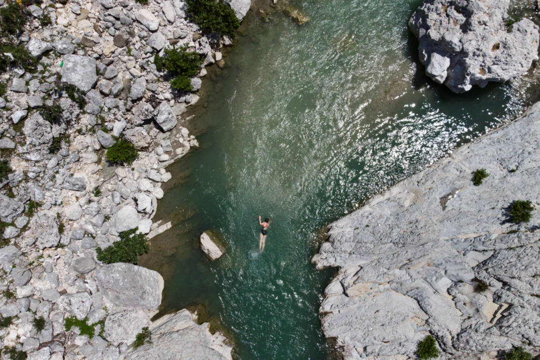 File Photo: A Woman Swims At The Shushica Tributary Of The Vjosa River, In Brataj