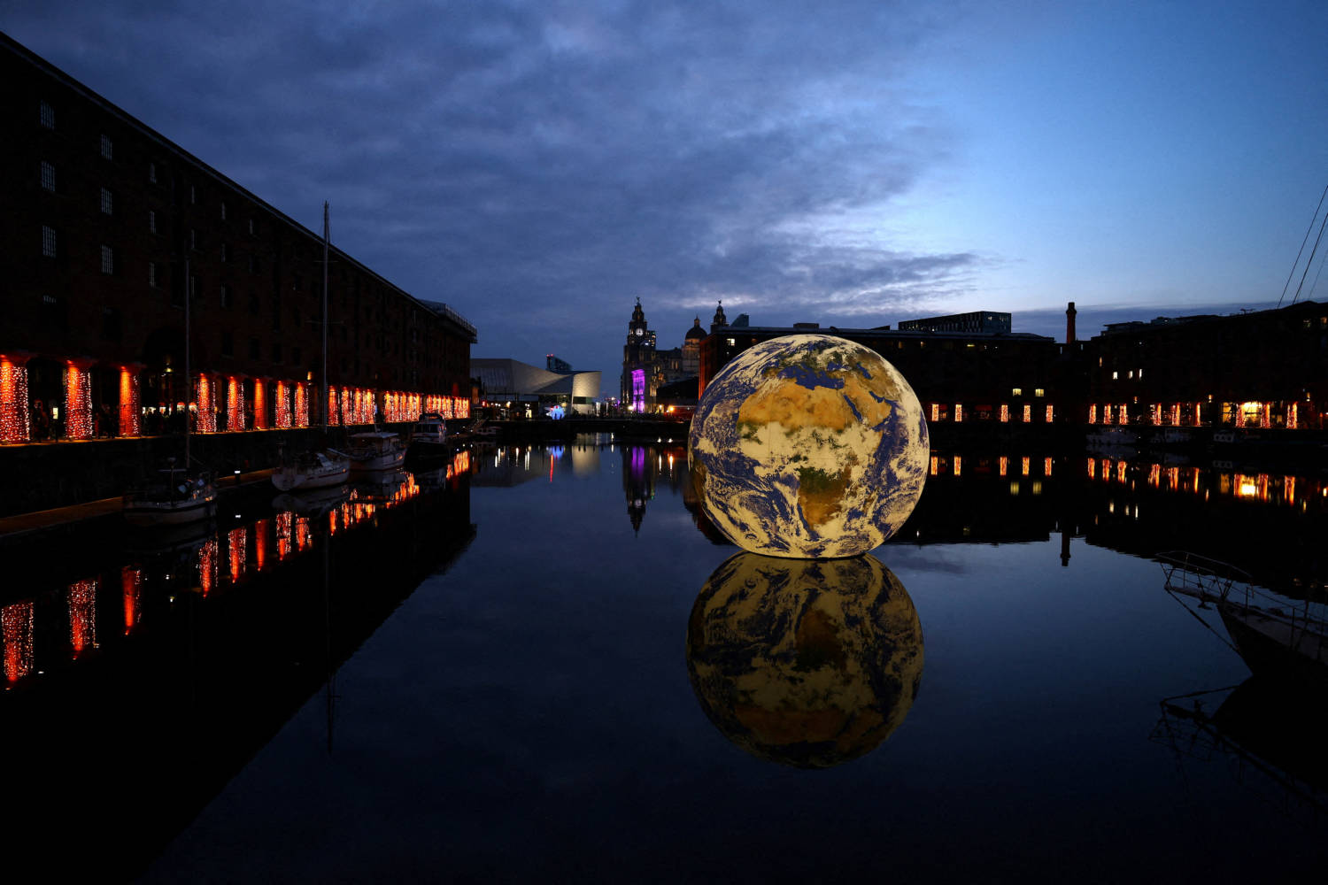 Luke Jerram's 'floating Earth', An Art Installation As Part Of The Eurovision Celebrations In The Albert Dock In Liverpool