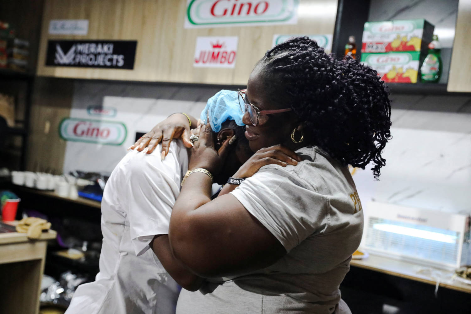 Nigerian Chef Hilda Bassey, 27, Is Hugged By Her Mother, Lynda Ndukwe, After Attempting To Break The Guinness World Record For The Longest Cooking Time By An Individual, In Lagos