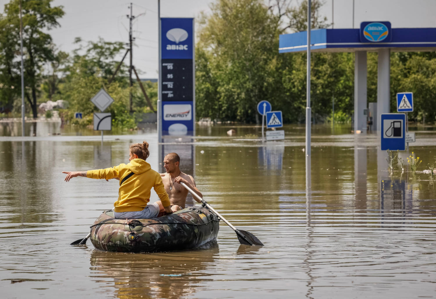 Local Residents Sail On A Boat At A Street During An Evacuation From A Flooded Area After The Nova Kakhovka Dam Breached In Kherson