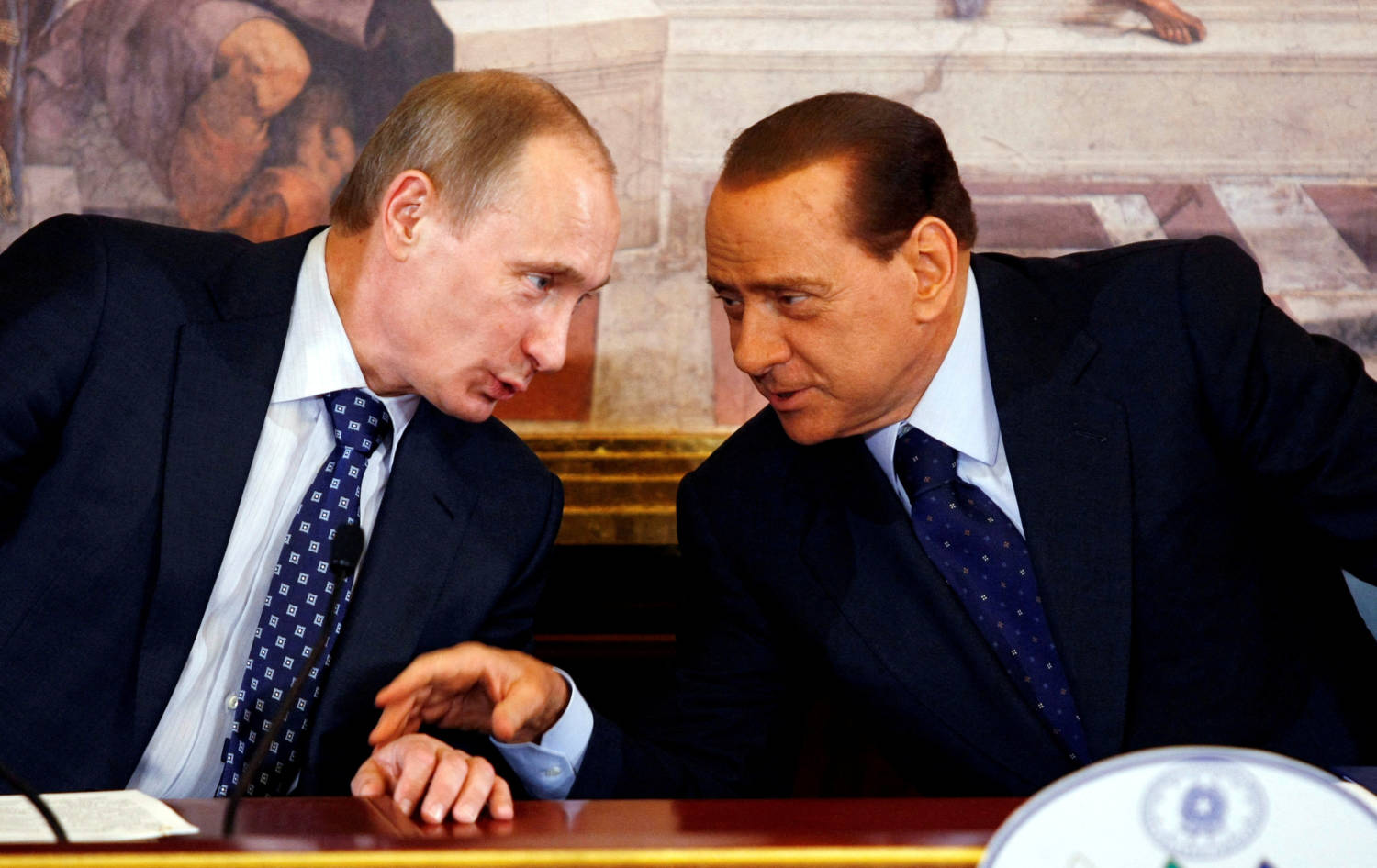 File Photo: Italian Pm Berlusconi Talks With Russian Pm Putin During A News Conference During A Summit At Villa Gernetto In Gerno