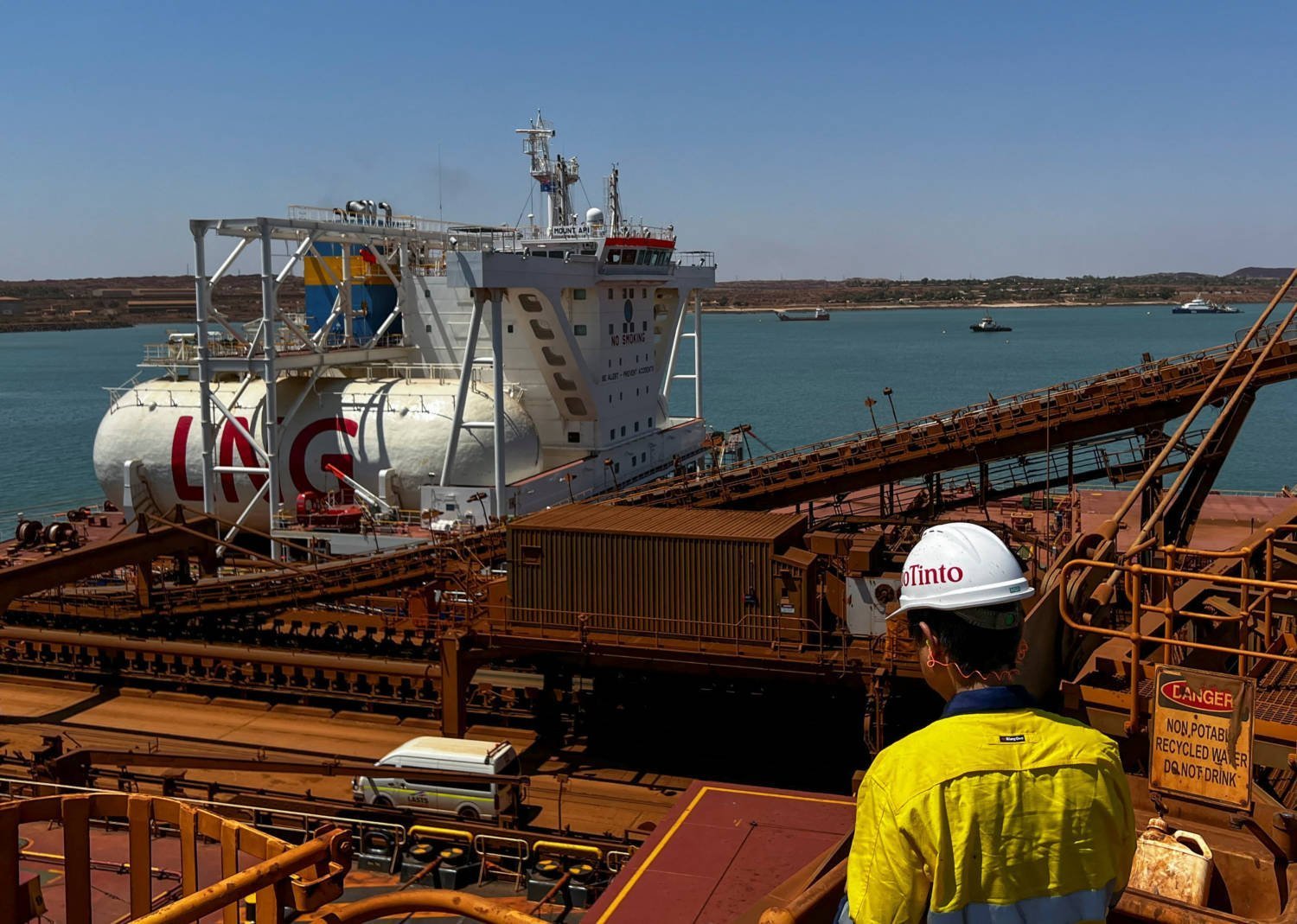 A Visitor To Rio Tinto's Dampier Port Operations Views A Bulk Carrier Ship Powered By Liquid Natural Gas
