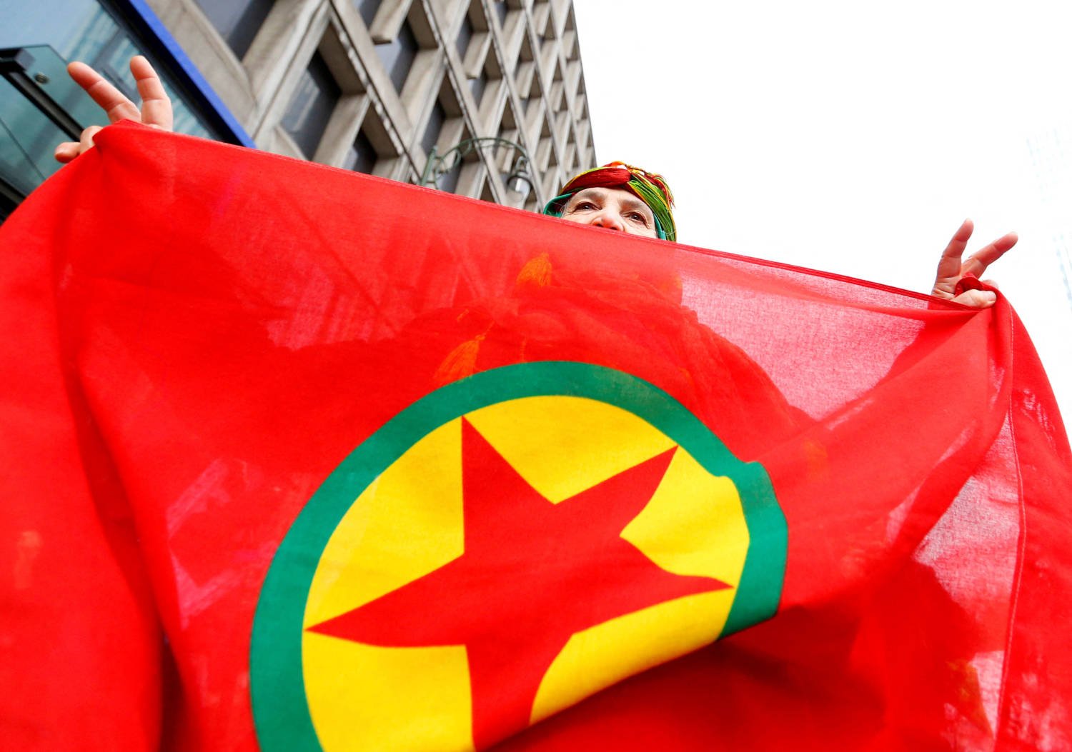 File Photo: A Woman Holds A Flag Of The Pkk During A Demonstration Against Turkish President Tayyip Erdogan In Central Brussels
