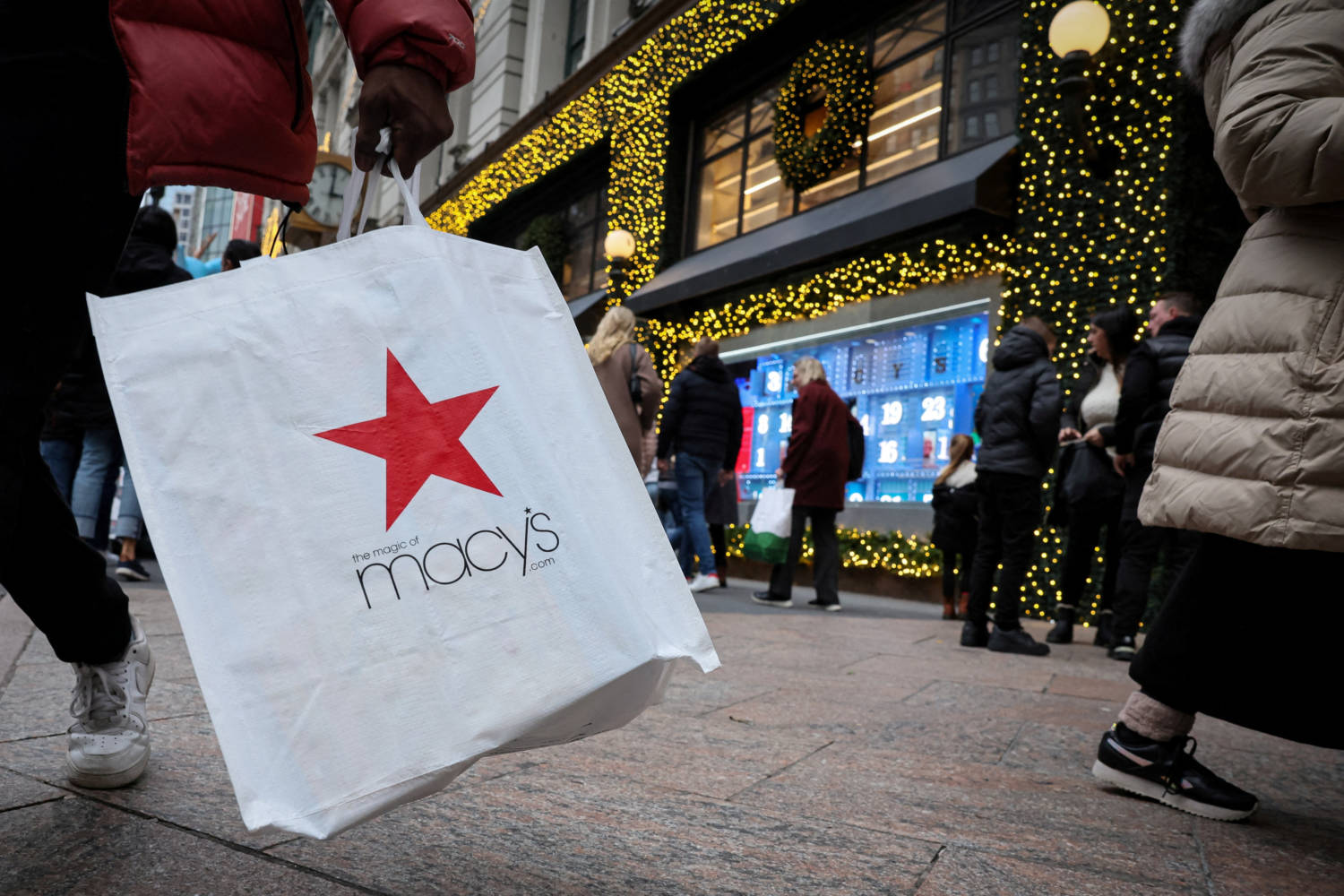 File Photo: A Customer Exits The Macy's Flagship Department Store In Midtown Manhattan In New York