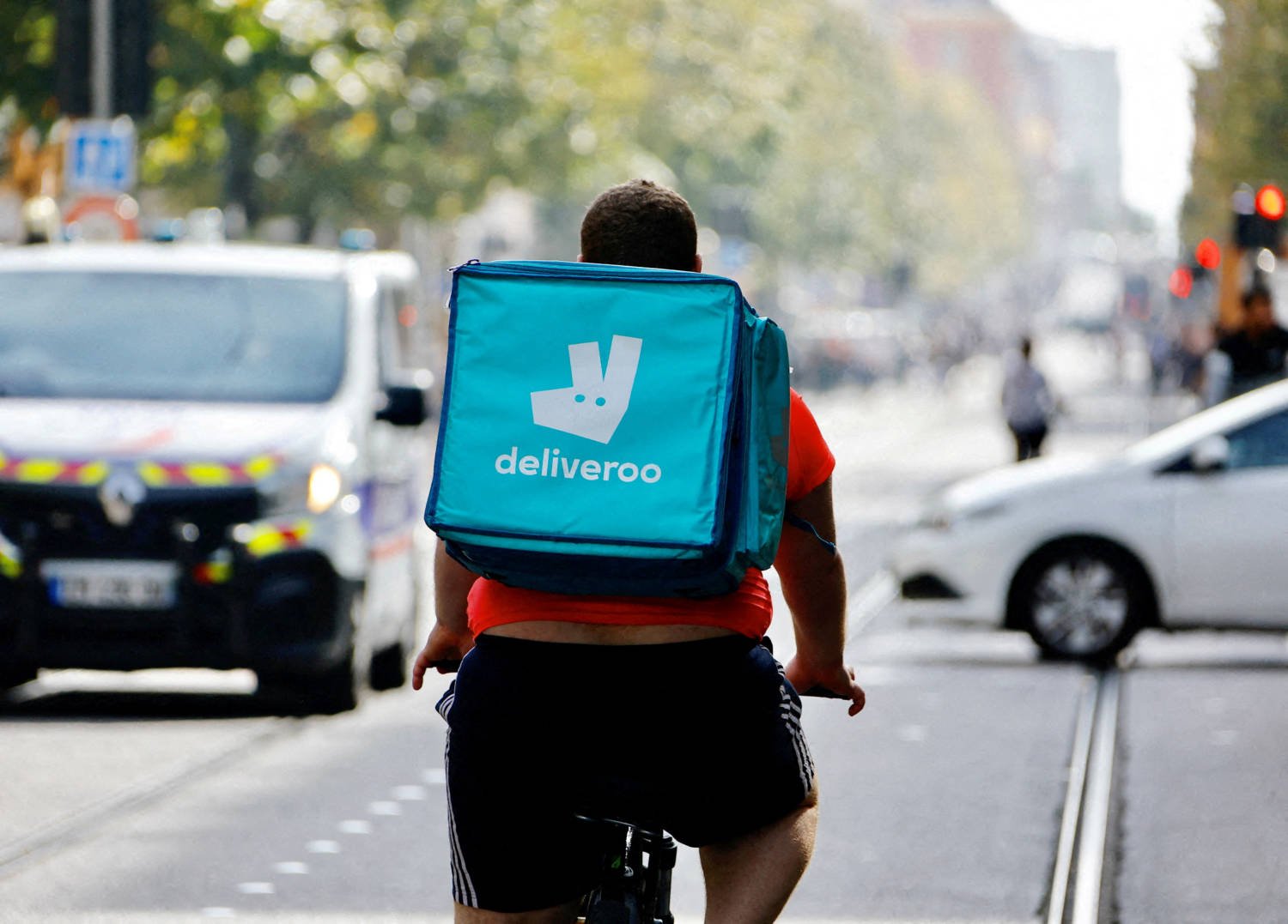 File Photo: A Delivery Worker Rides A Bike In Nice