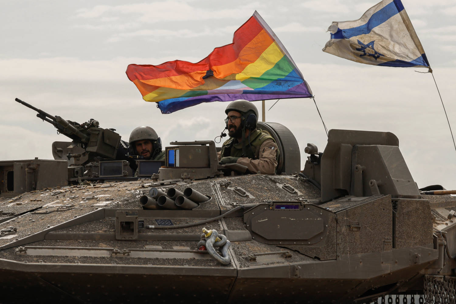 An Israeli Apc With A Rainbow Flag With A Star Of David And An Israeli National Flag Re Enters Israel from gaza, Near The Israel Gaza Border, In Southern Israel