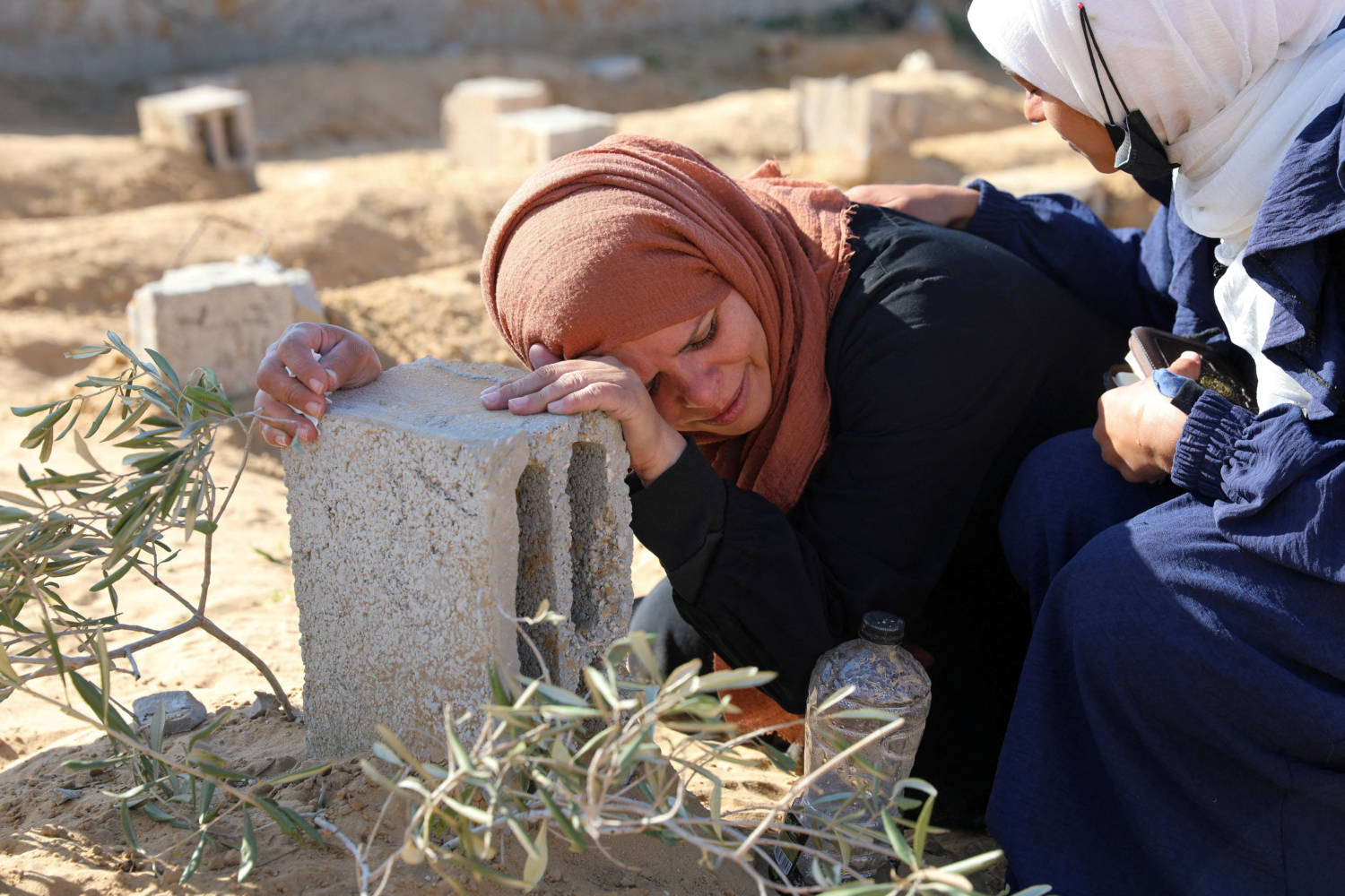 A Palestinian Woman Reacts At The Grave Of Her Son Killed In An Israeli Strike, In Khan Younis