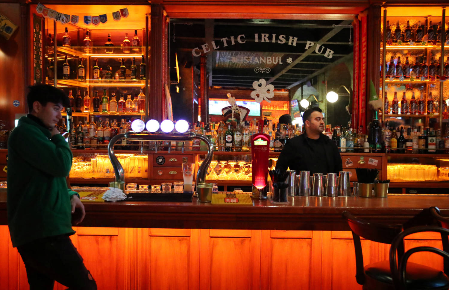 A Barman And An Employee Wait For Customers At A Bar In Istanbul