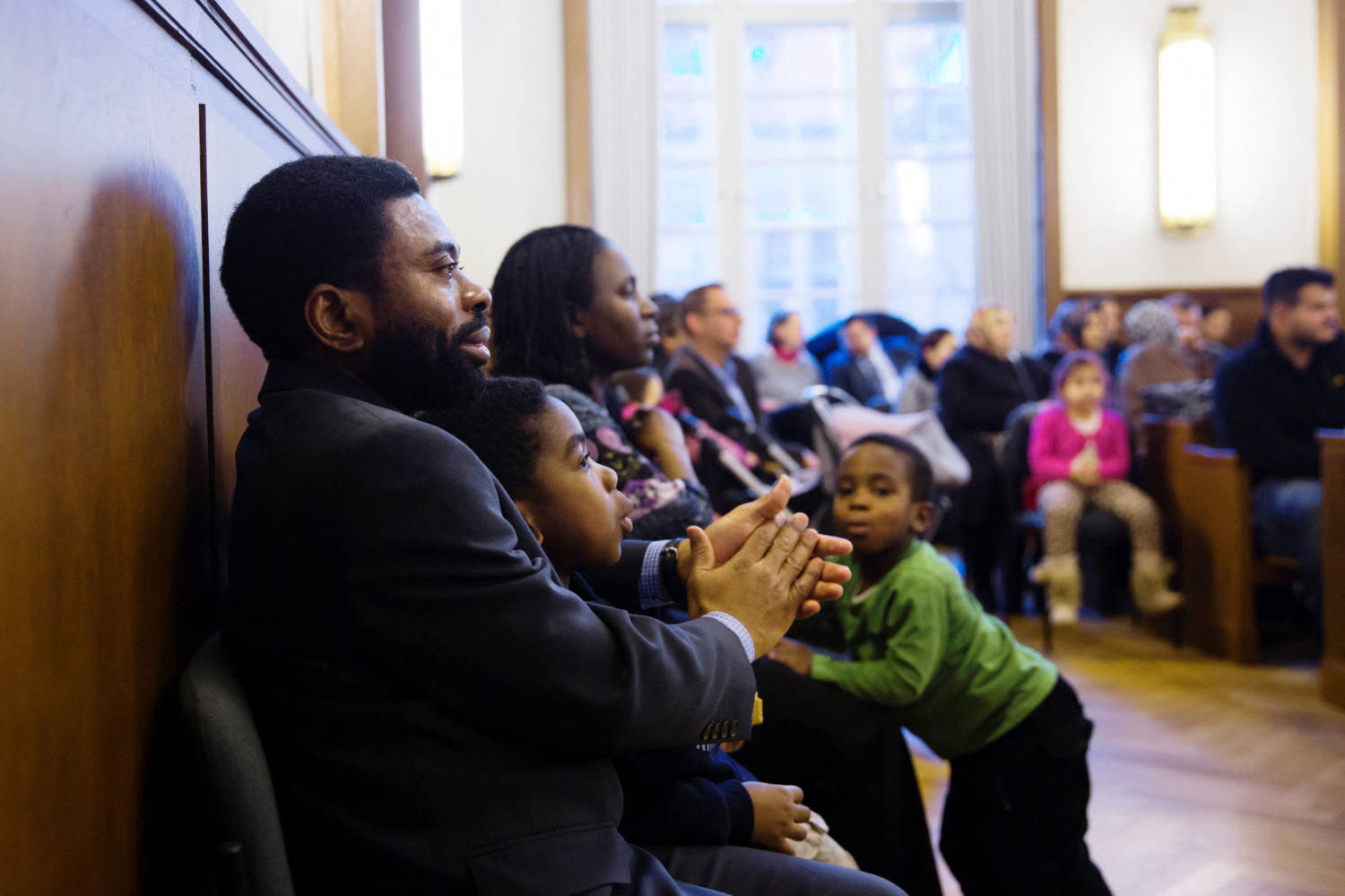 African Family Wait For Their Turn To Be Naturalised As Germans During Ceremony At Neukoelln Townhall In Berlin