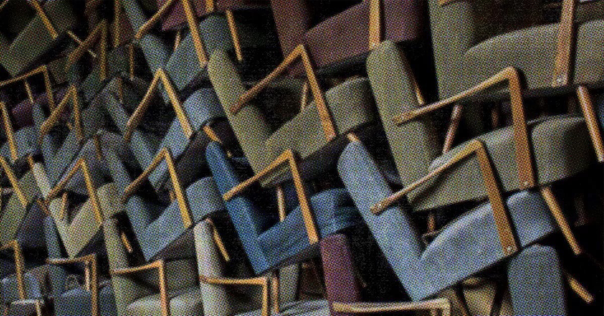 A Bunch Of Chairs Piled Up