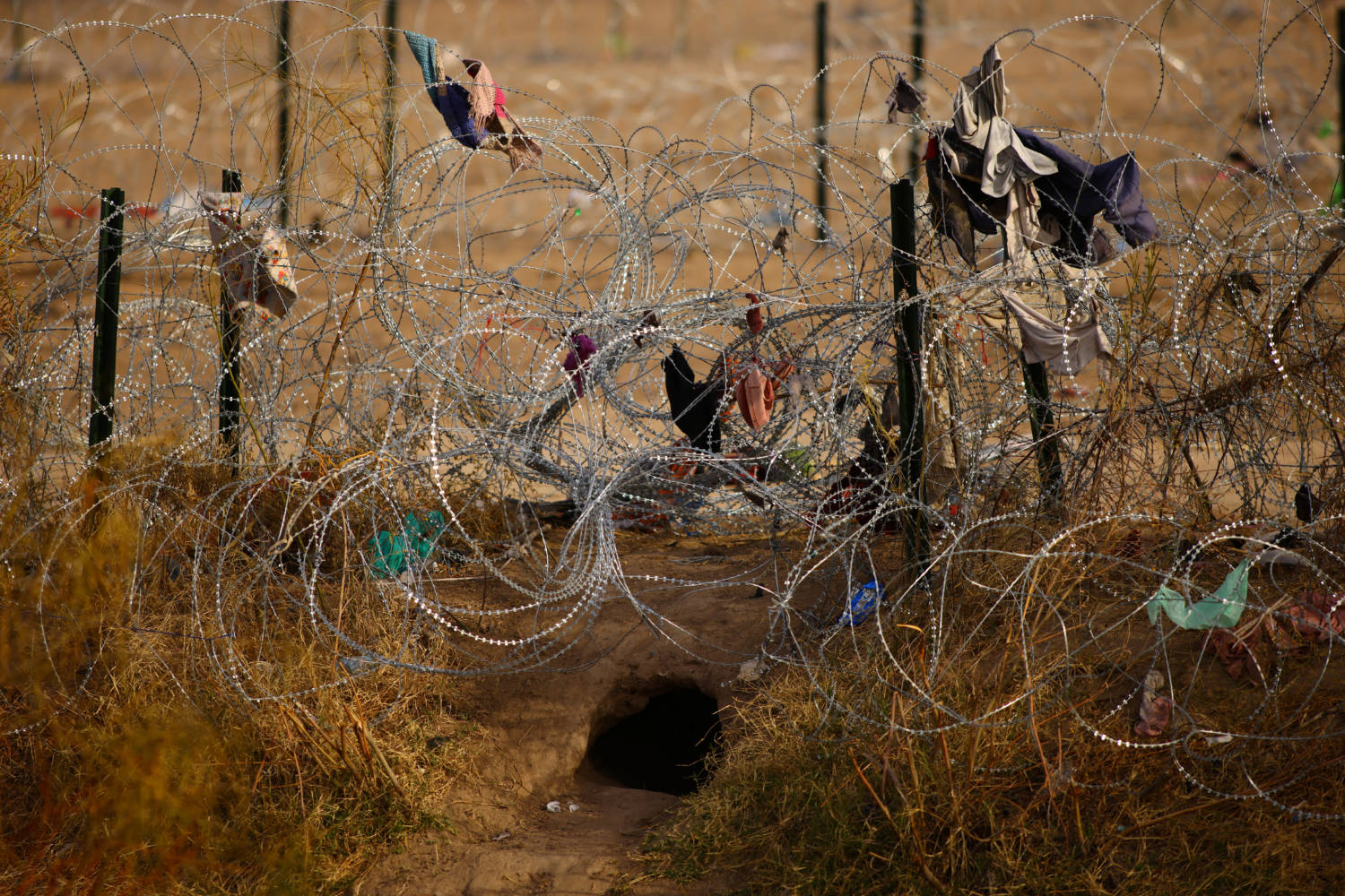A Hole Is Seen Near A Razor Wire Fence Used To Prevent Migrants From Crossing Into The United States, At The Border Between The United States And Mexico, As Seen From Ciudad Juarez