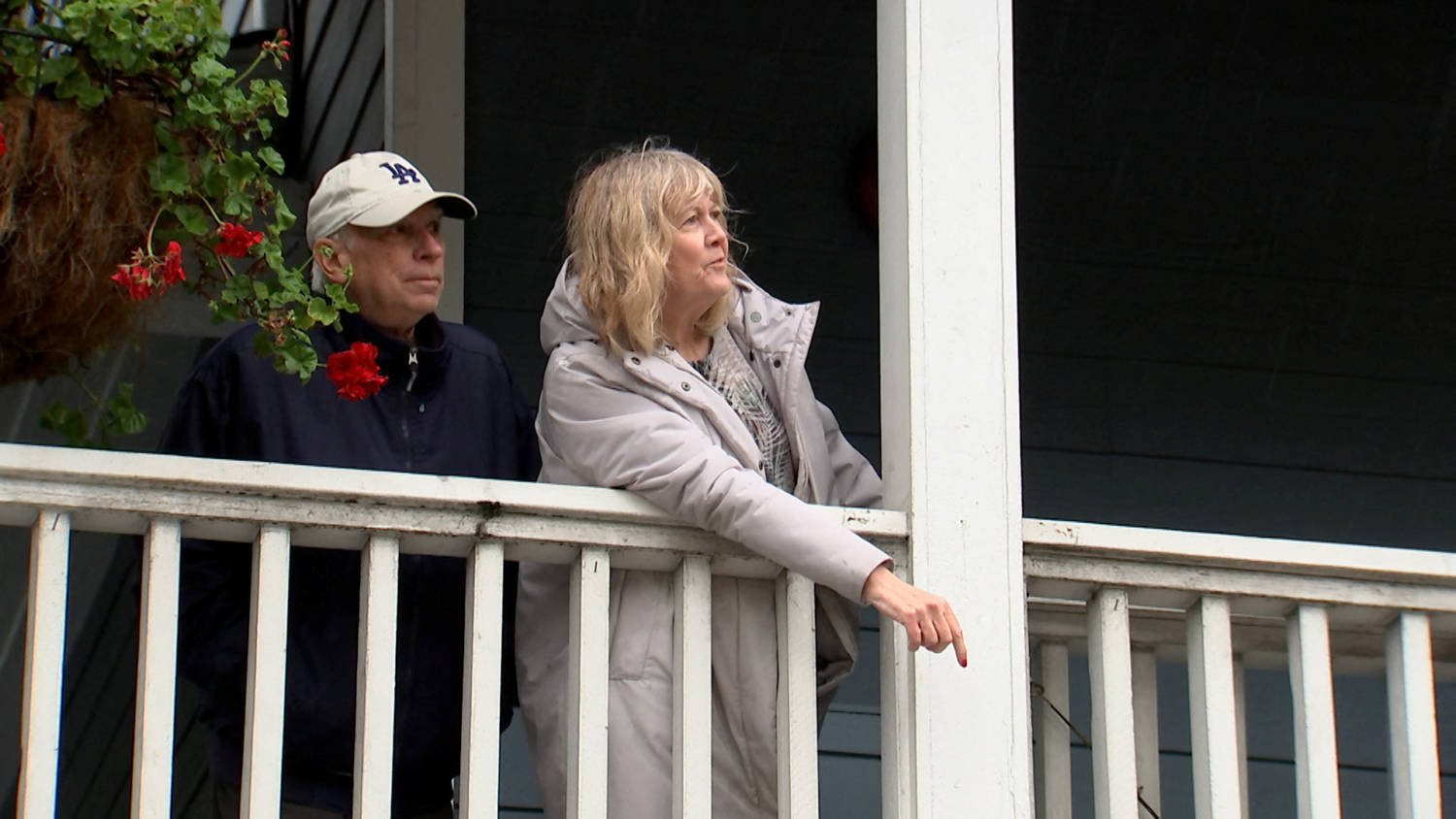 Alice White Zmigrocki And Her Husband Joe Zmigrocki Look From A Inn At Playa Del Rey's Balcony As Workers Pump Flood Water From The Street Surrounding The Place, In Los Angeles