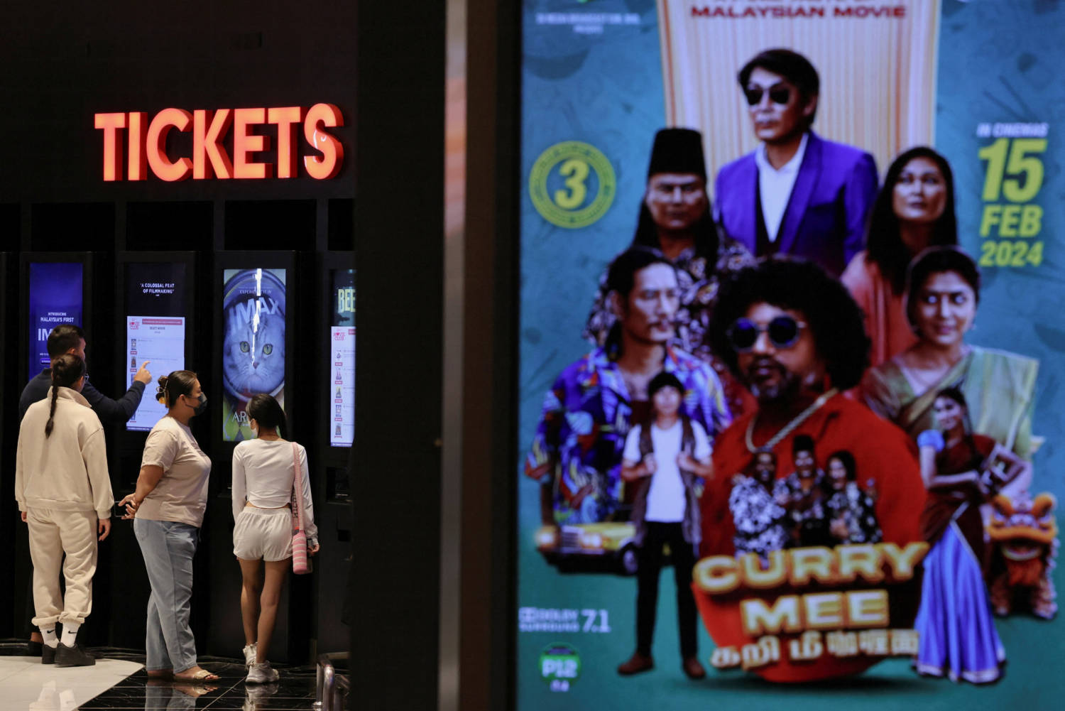 People Buy Movie Tickets From A Movie Ticket Kiosk At A Cinema In Kuala Lumpur