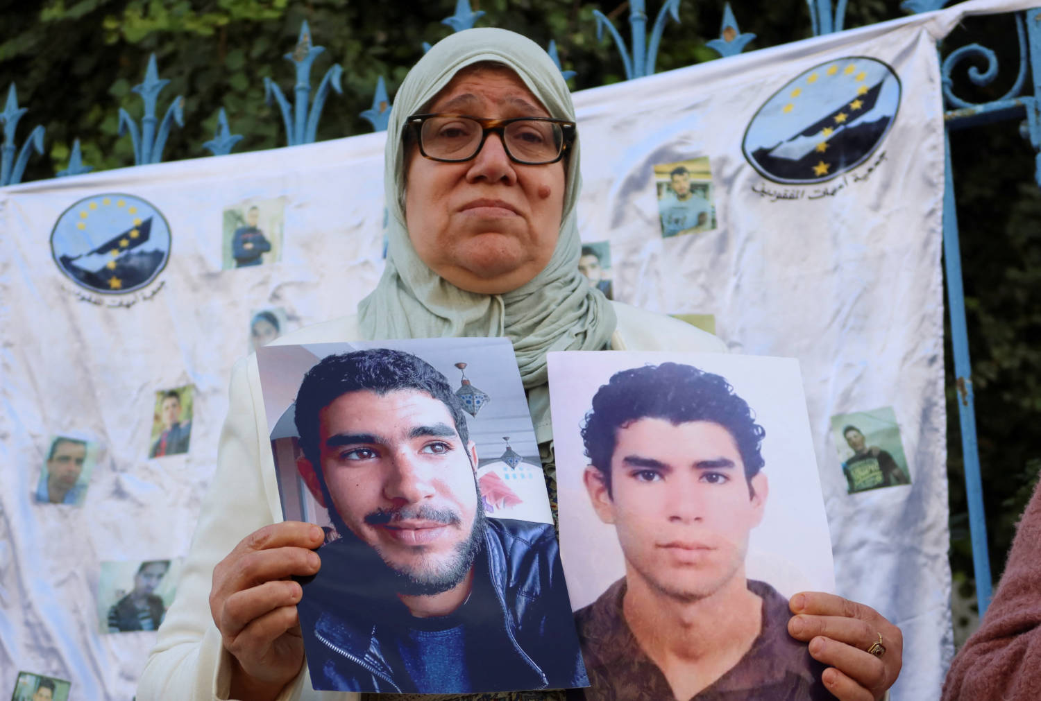 Awatef Daoudi, A Tunisian Teacher Who Lost Her Son At Sea, Carries His Pictures During A Protest In Tunis