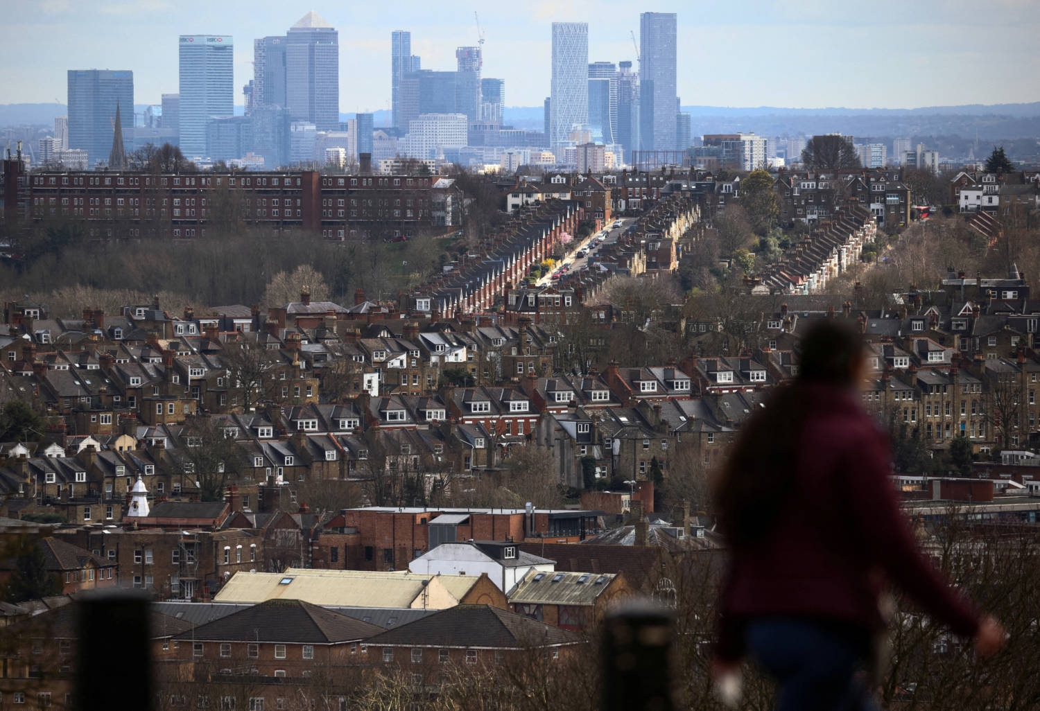 File Photo: Rows Of Houses Lie In Front Of The Canary Wharf Skyline In London