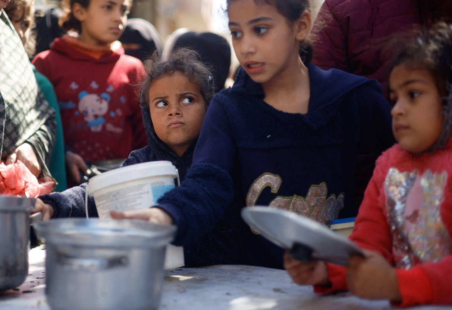 Palestinian Children Wait To Receive Food Cooked By A Charity Kitchen Amid Shortages Of Food Supplies, In Rafah