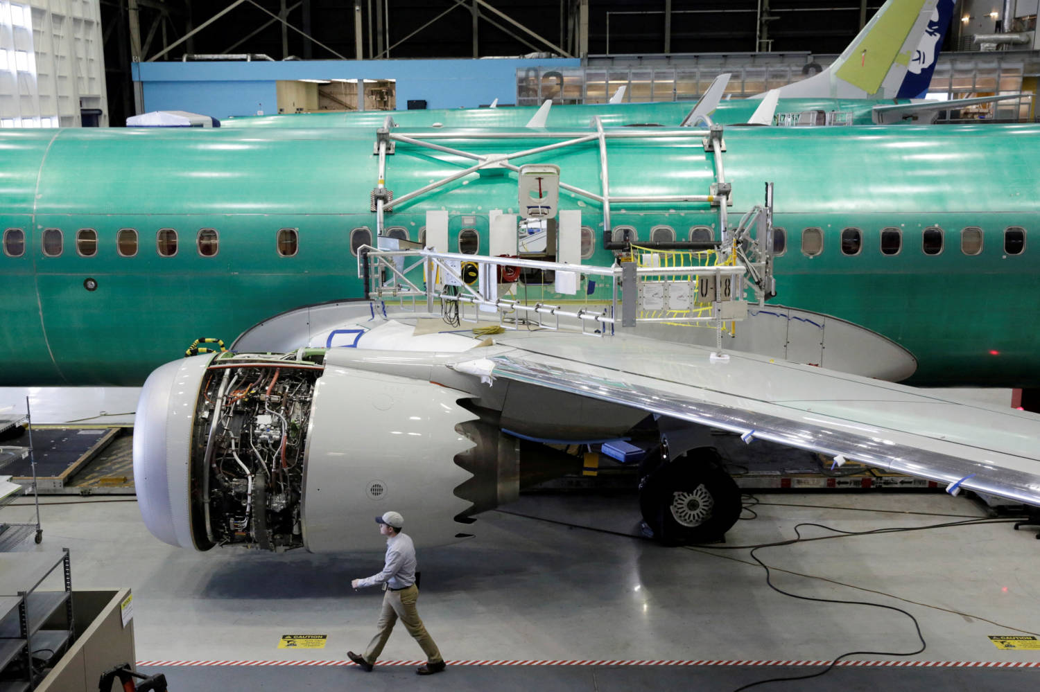 File Photo: A Worker Walks Past Boeing's New 737 Max 9 Under Construction At Their Production Facility In Renton, Washington