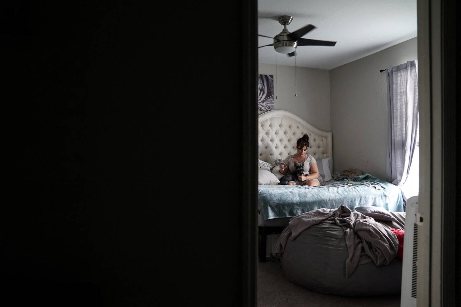 Amanda Dicrosta Sits On Her Bed In Her Apartment In Orlando