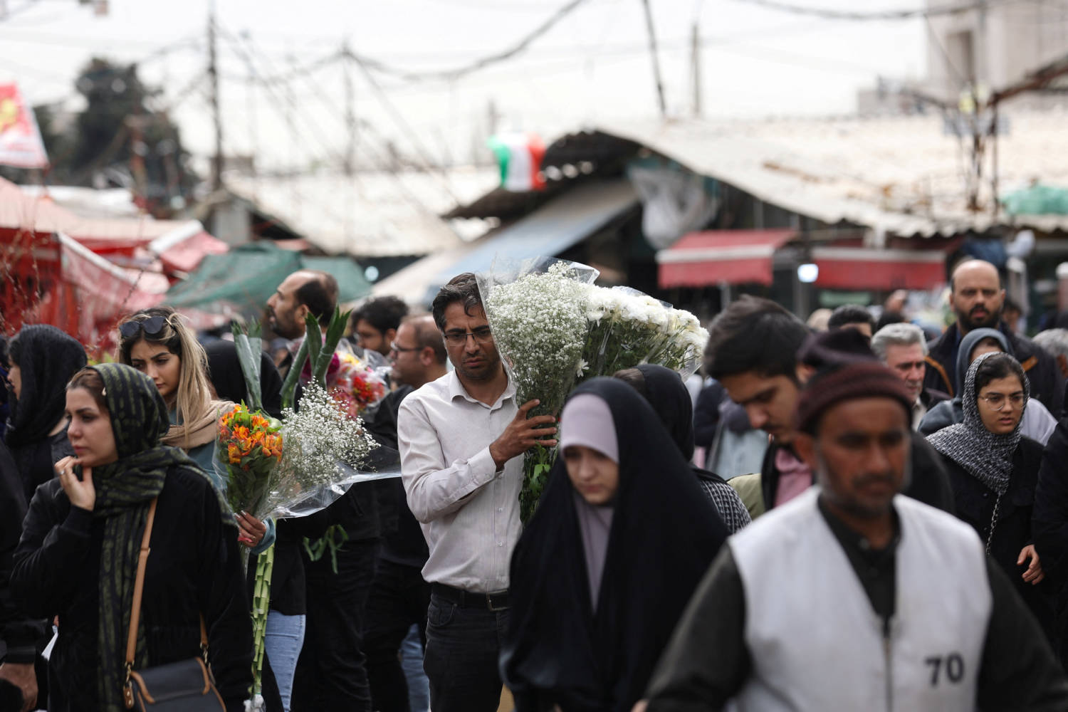 Iranian People Walk At A Flower Market, Ahead Of Nowruz, The Iranian New Year, In Tehran