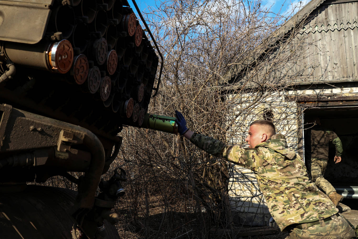 Ukrainian Serviceman Loads A Rocket Into A Grad Mlrs Before Fire Toward Russian Troops Near A Front Line In Donetsk Region