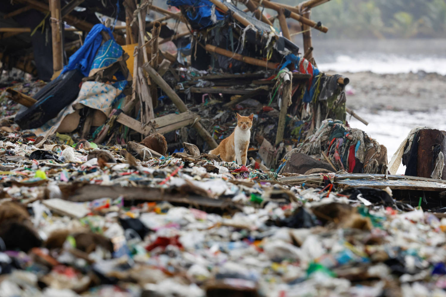 Indonesian Fishing Village Grapples With Piles Of Trash Amid Erratic High Tides