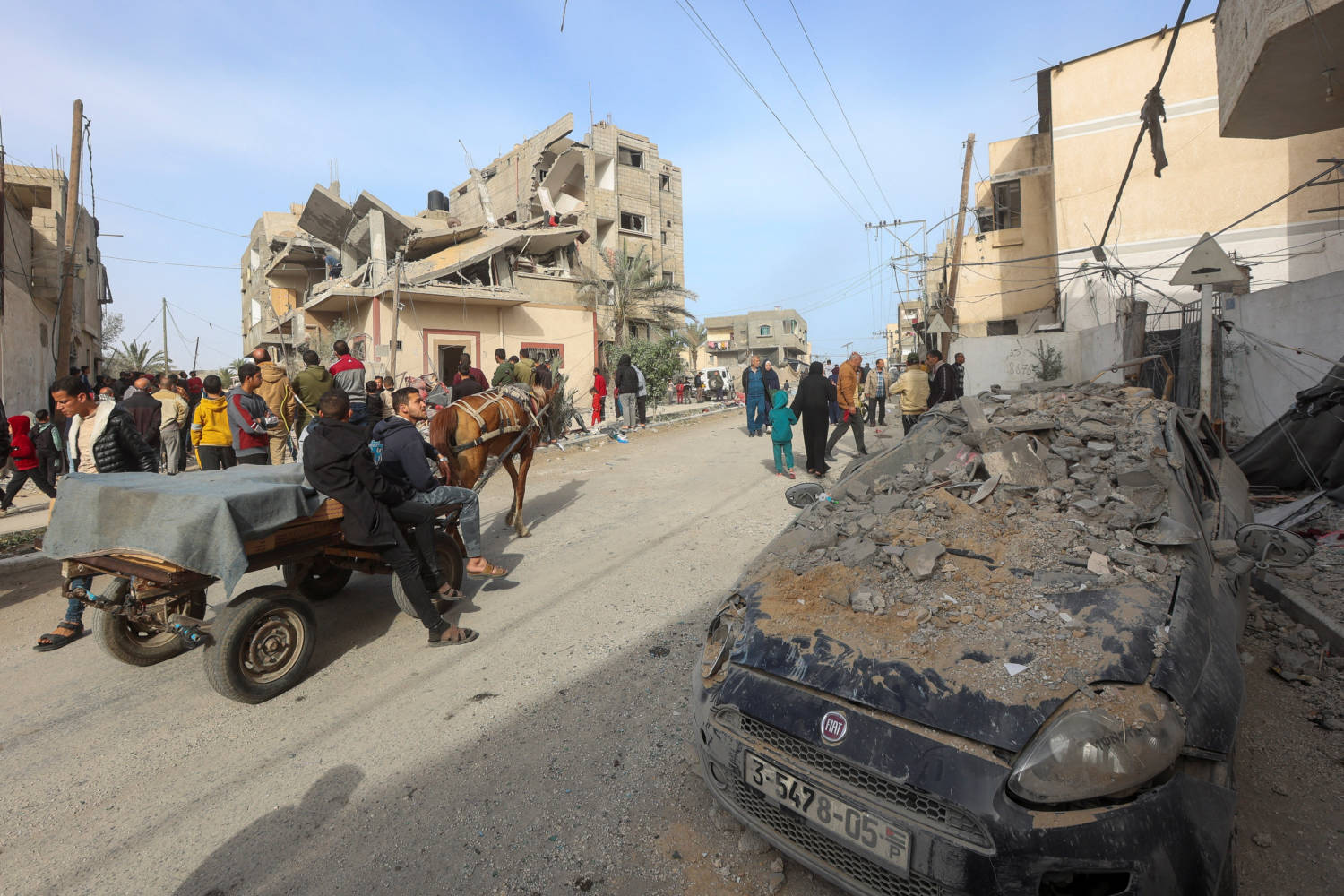 Palestinians Inspect The Site Of An Israeli Strike On A House, In Rafah, In The Southern Gaza Strip