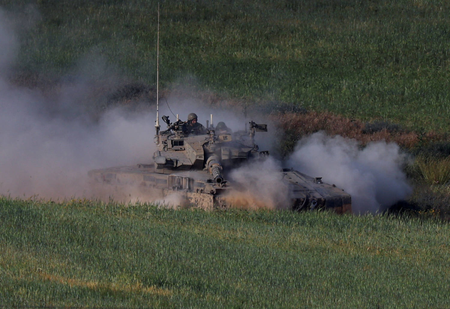 An Israeli Tank Manoeuvres Near The Israel Gaza Border, In Southern Israel