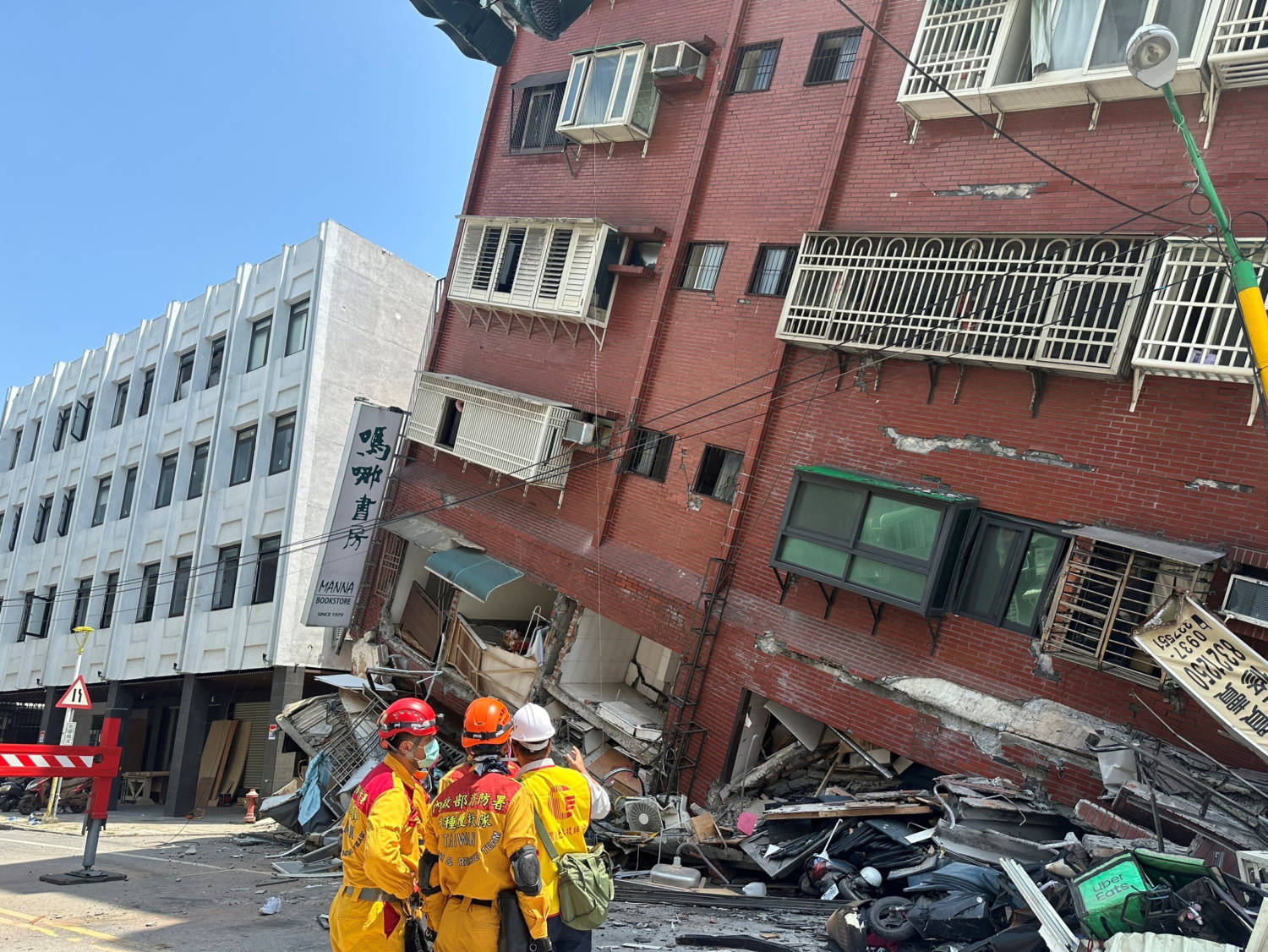 Firefighters Work At The Site Where A Building Collapsed Following The Earthquake, In Hualien