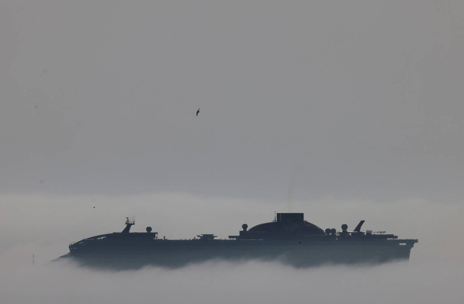 A Cruise Ship Is Seen Through The Fog Outside The Port In Larnaca