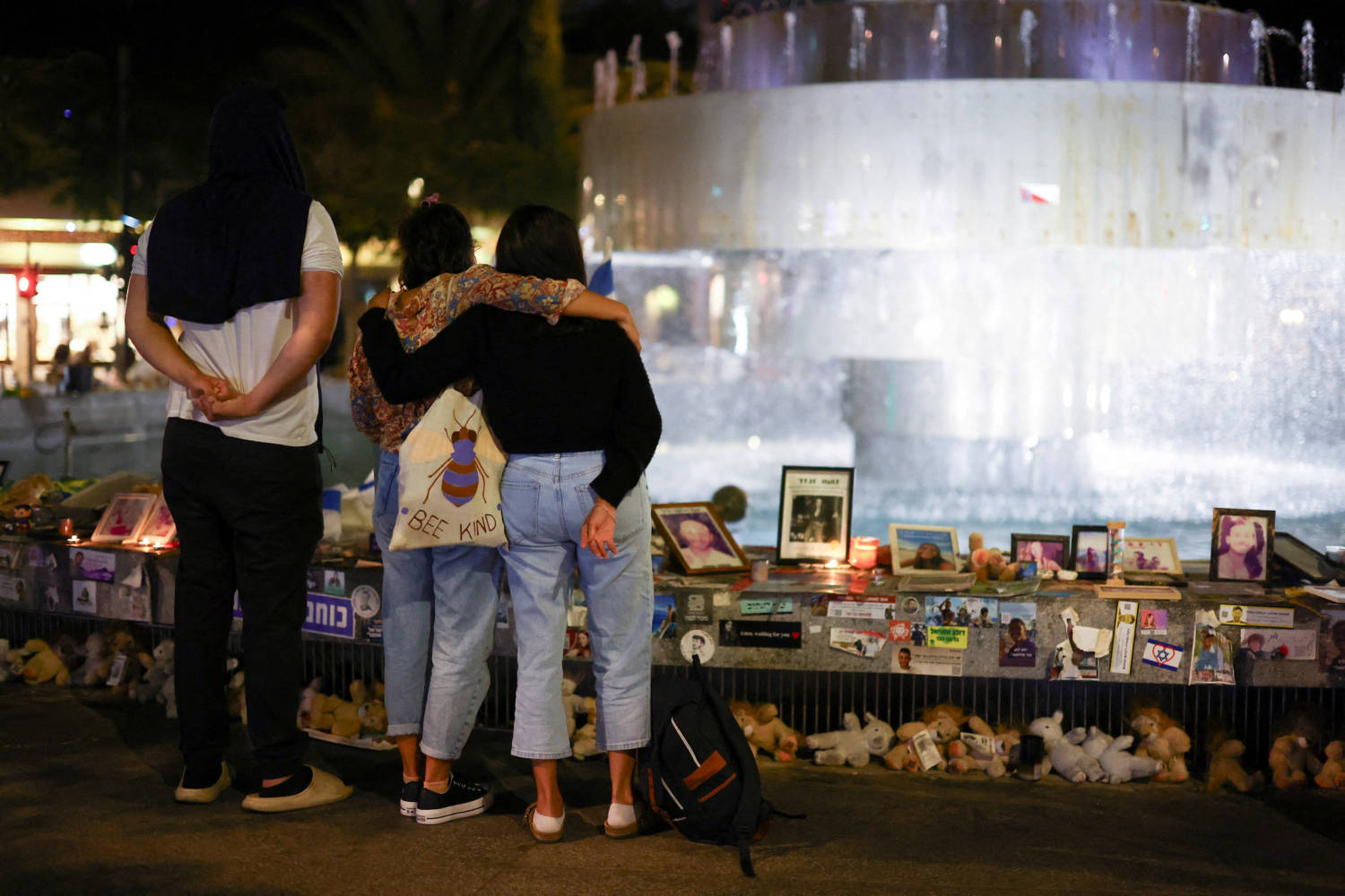 People Stand Next To Memorabilia And Pictures Of The Hostages Kidnapped In The Deadly October 7 Attack On Israel By The Palestinian Islamist Group Hamas From Gaza, At Dizengoff Square In Tel Aviv