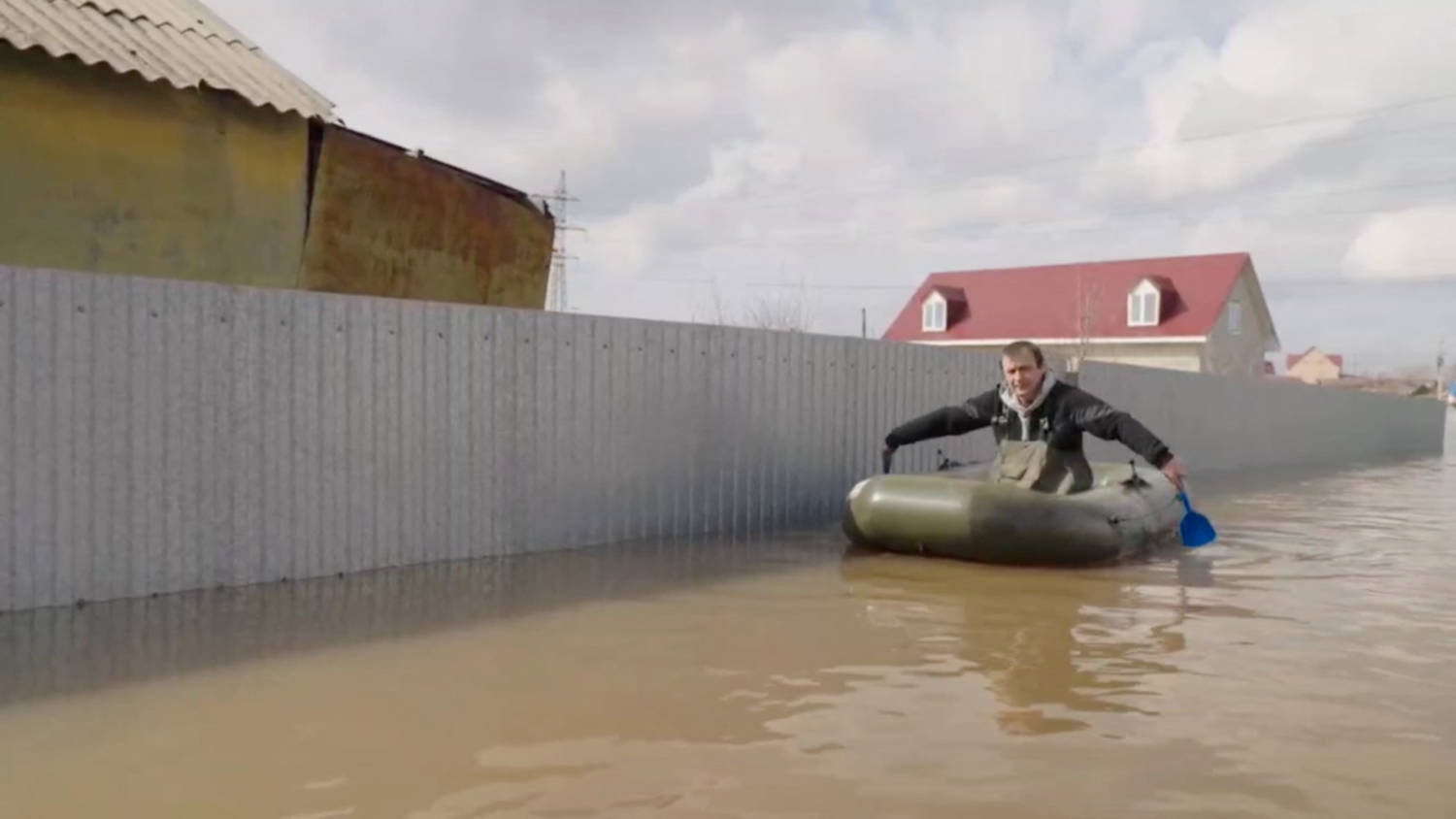 A Man Rows A Boat In A Flooded Street In Orenburg