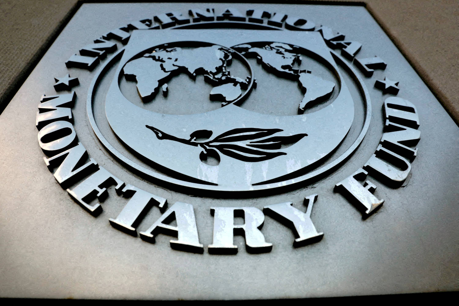 File Photo: File Photo: The Imf Logo Is Seen Outside The Headquarters Building In Washington